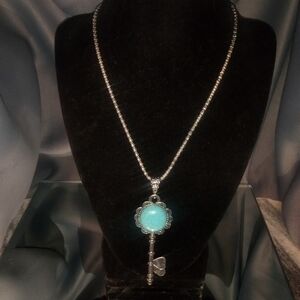 Silver Key Pendant Necklace with turquoise colored center with matching earrings